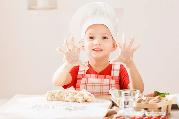 Cooking pizza is fun - little chef playing with flour — Stock Photo, Image