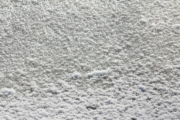 Arka plan beyaz kış günü kar. Sezon soğuk hava, doku soyut.