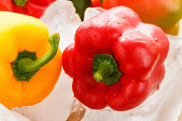 Green , yellow and red bell pepper with ice