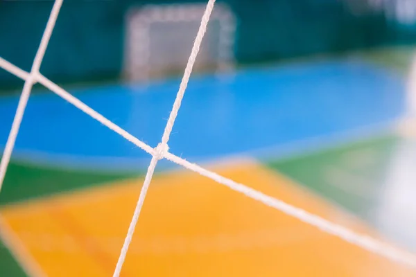 Fußball defokussiert Torplatz, Futsal-Ball-Feld in der Sporthalle Halle, Fußball-Sportplatz — Stockfoto