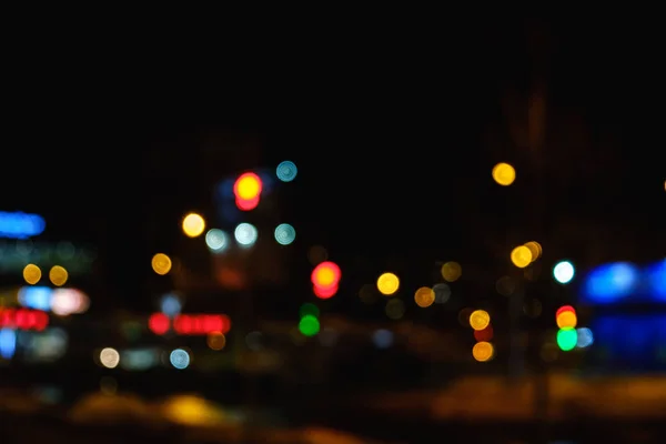 Bokeh nachtlampje in de grote stad, abstracte achtergrond wazig. — Stockfoto