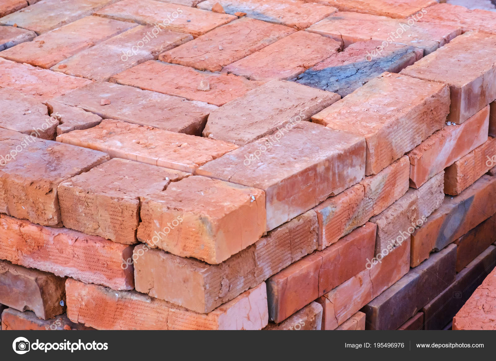 Building materials, red brick on pallet, a pile of bricks ...