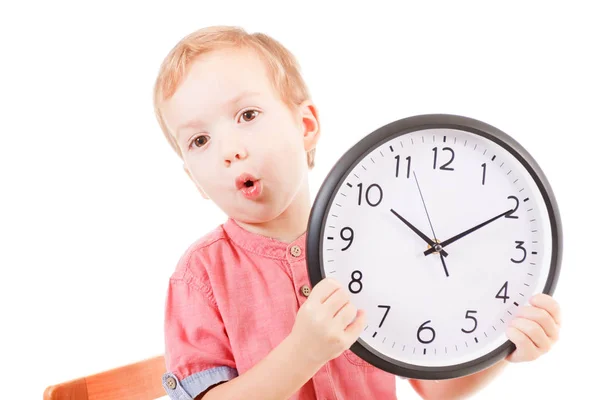 Smiling caucasian boy child holding a clock isolated white — Stock Photo, Image