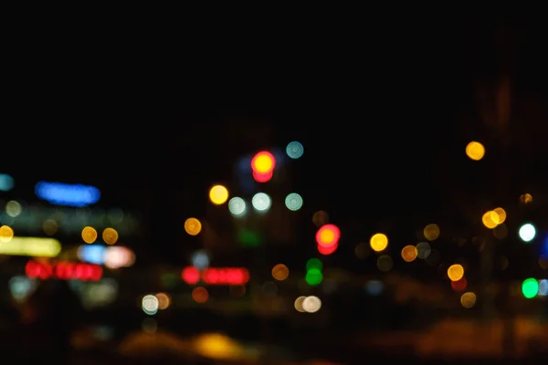 Noche bokeh luz en la gran ciudad, fondo difuminado abstracto . —  Fotos de Stock