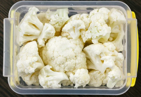 Top view vegetables cauliflower plastic case container.