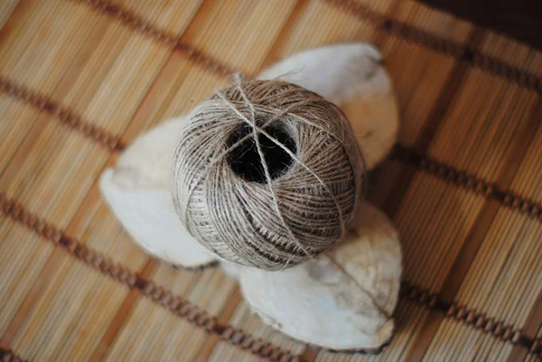 Tangle of jute twine on a wooden stand handmade