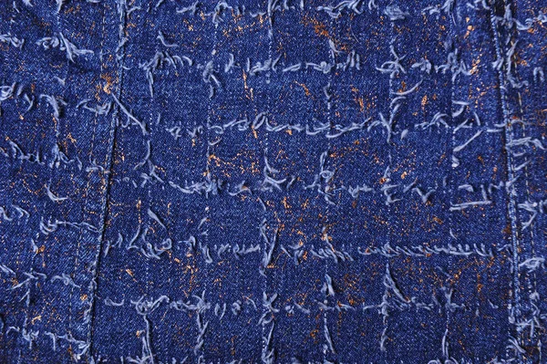 Текстура синього джинсу з золотими нитками — стокове фото