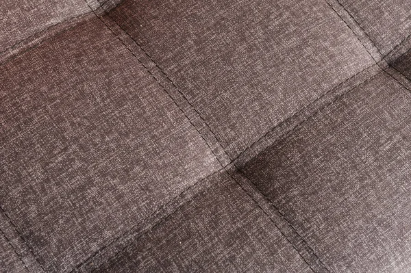 Texture del tessuto con cuciture. Primo piano. Colore marrone-beige — Foto Stock