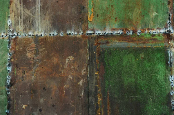 Çizikler ve çatlaklar ile yeşil metal doku