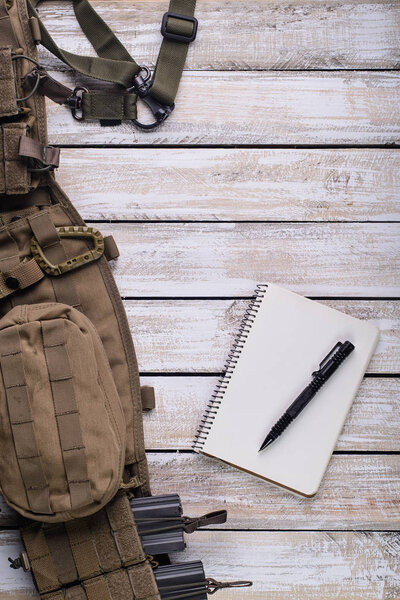 Notebook with pen and battle belt