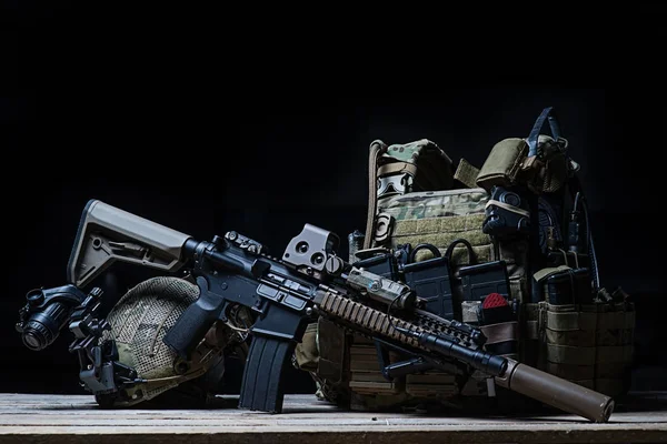 Rifle with silencer, bulletproof vest, helmet — Stock Photo, Image