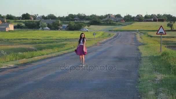 Brunette girl dancing on a road — Stock Video