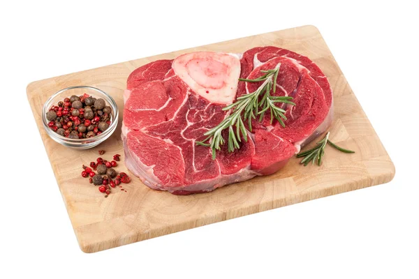 Fresh raw beef steak with bone on cutting board on white backgro — Stock Photo, Image