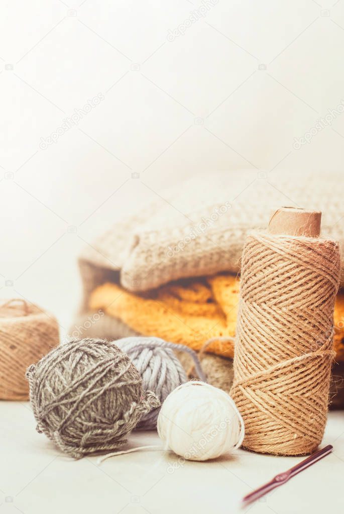 color woolen clews for knitting on white background