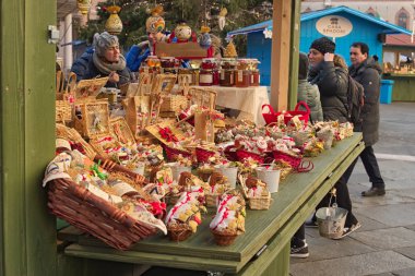 RAVENNA, ITALY: JANUARY 01, 2017- Christmas market with kiosks and stalls, people bying gifts clipart