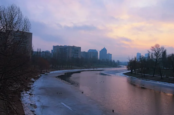 Housing area by the channel. A typical residential (sleeping) area on the right bank of the Dnieper in Kiev. Ukraine. Sunrise on a winter morning — Stock Photo, Image