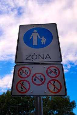 Pedestrian zone sign. Table with sign prohibiting riding scooters, bicycles, carts, monowheels and segway. Budapest, Hungary