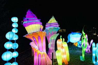 Kyiv, Ukraine-January 25, 2020: Scenic installation of sea life with big shark and different sea plants. Figures illuminated by many lanterns during Festival of Chinese lanterns