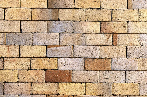Stone block seamless background. Brick path with different colors stones. Sandstone pavement, crude stone, pebble pavement, wall of stone, cobbled street. Gardening outdoor and indoor interiors.