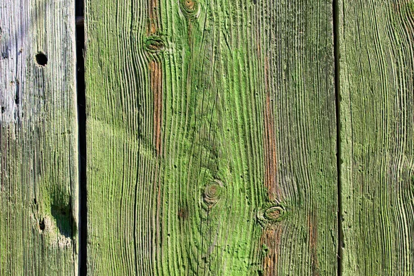 View of aged green wooden background texture. Shabby green wooden planks. Aged wooden planks with texture. Abstract background.