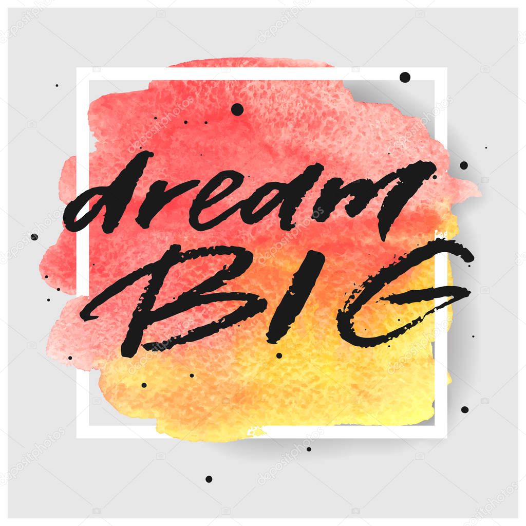 Dream big hand drawn lettering on watercolor splash on watercolor splash in red and yellow colors.