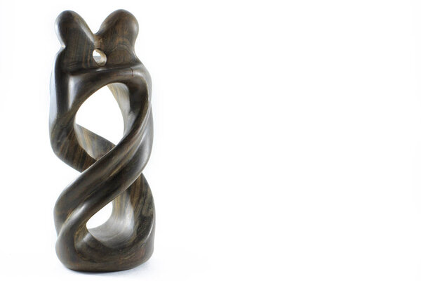 African naive art. Statue merging the bodies of men and women. 