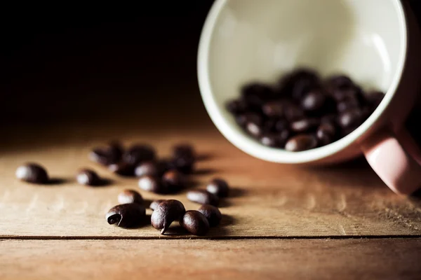 Vintage coffee bean on brown wooden — Stock Photo, Image