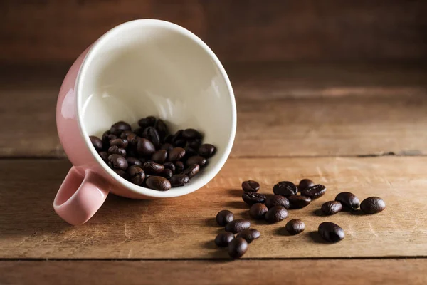 Vintage coffee bean on brown wooden — Stock Photo, Image