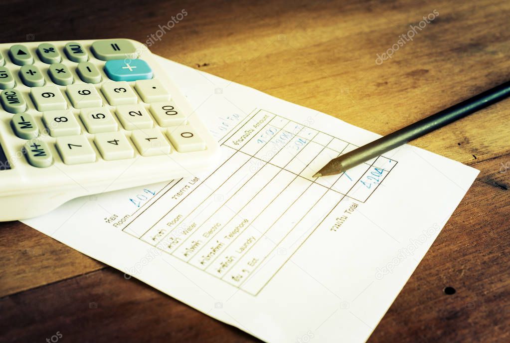 Utility bill with calculator and pencil, Save money concept