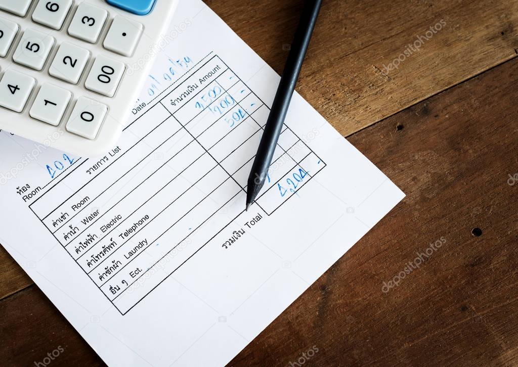 Utility bill with calculator and pencil, Save money 