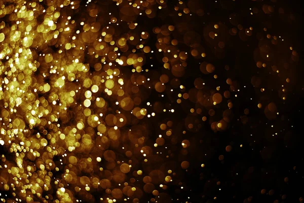 Bokeh Licht Gold Farbe schwarzer Hintergrund — Stockfoto