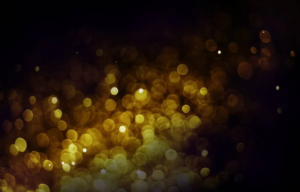 Bokeh luz oro color negro fondo — Foto de Stock