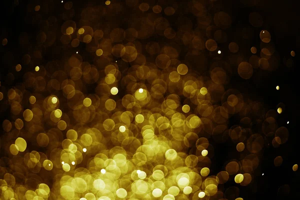 Bokeh világos arany színű fekete háttér — Stock Fotó