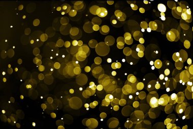 Siyah zemin üzerine Altın ışık bokeh 