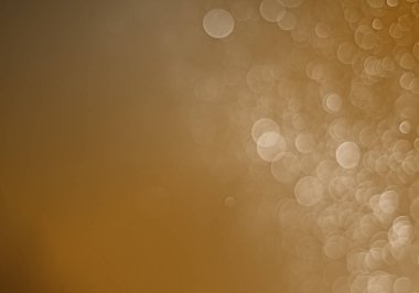 Bokeh siyah arka plan üzerine açık altın renk 