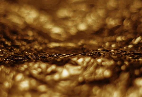 Glitter bokeh luce oro astratto su sfondo nero — Foto Stock