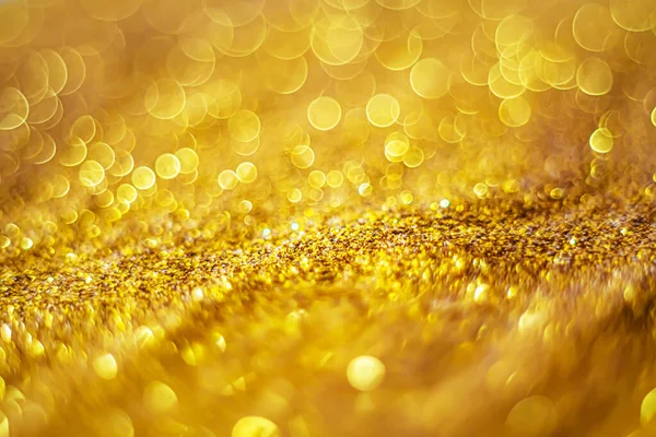 Glitter light abstract gold bokeh blurred background — Stock Photo, Image