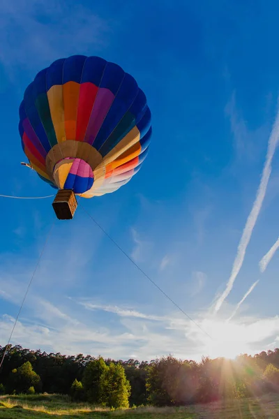Colorful hot air balloon in blue sky — Stock Photo, Image