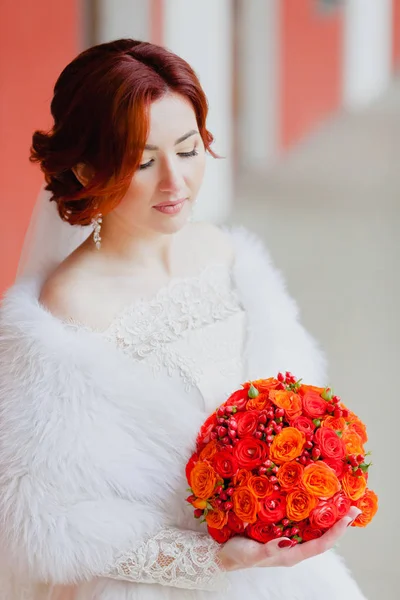 Bride portrait in the gallery with the bridal bouquet