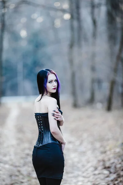 Portrait of the gothic woman in the dark winter forest — Stock Photo, Image