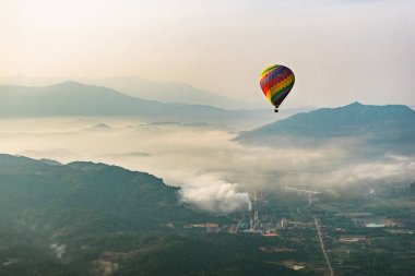 Hot air balloon flying in Vang Vieng, Laos clipart