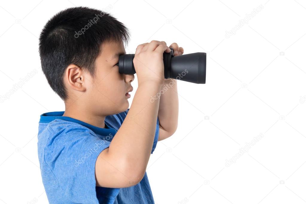 Asian Chinese little boy holding binoculars in isolated background