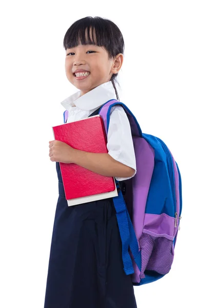 Aziatische Chinese basisschool meisje houdt van boeken met tas — Stockfoto