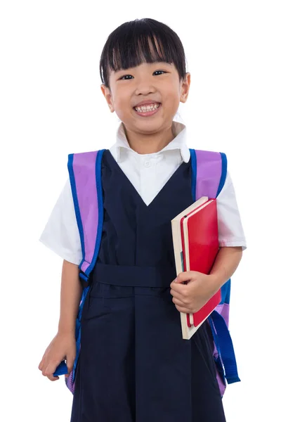 Asiático chino poco escuela primaria chica sosteniendo libros con bolsa —  Fotos de Stock