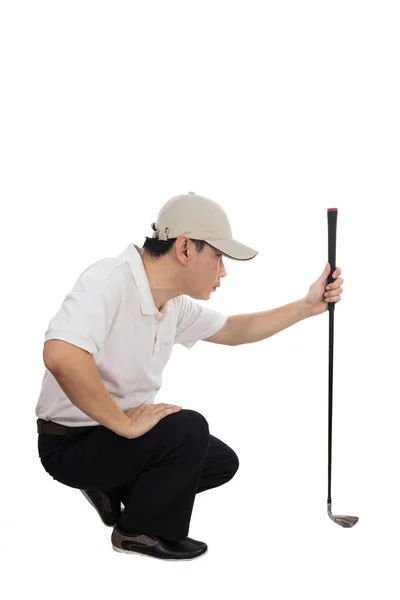 针对他的亚洲中国男高尔夫球手把枪 — 图库照片