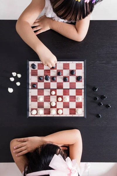 stock image Aerial view of Asian Chinese little sisters playing chess togeth