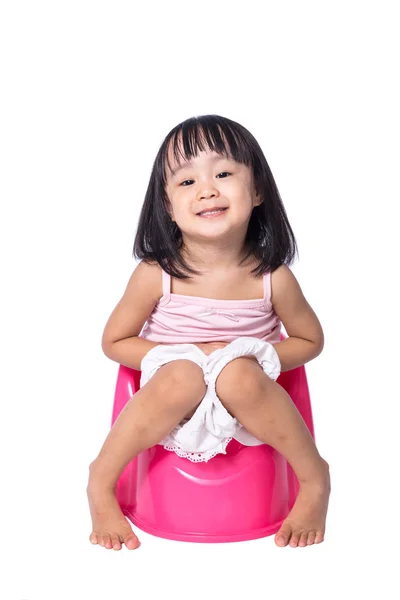 Asian chinese little girl sitting on chamberpot — Stock Photo, Image