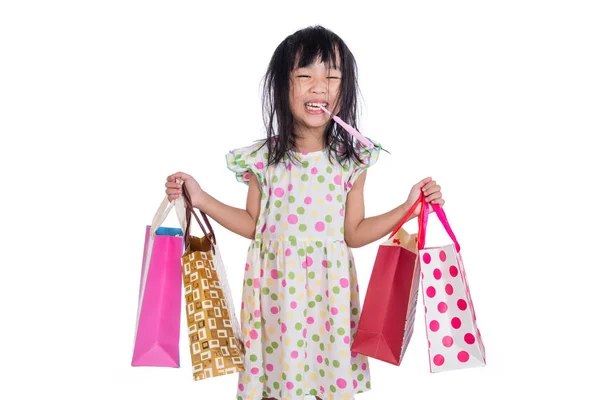 Азиатская девочка с сумками для покупок — стоковое фото