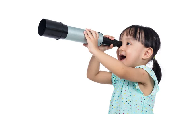 Asian Chinese little girl looking through a telescope — Stock Photo, Image