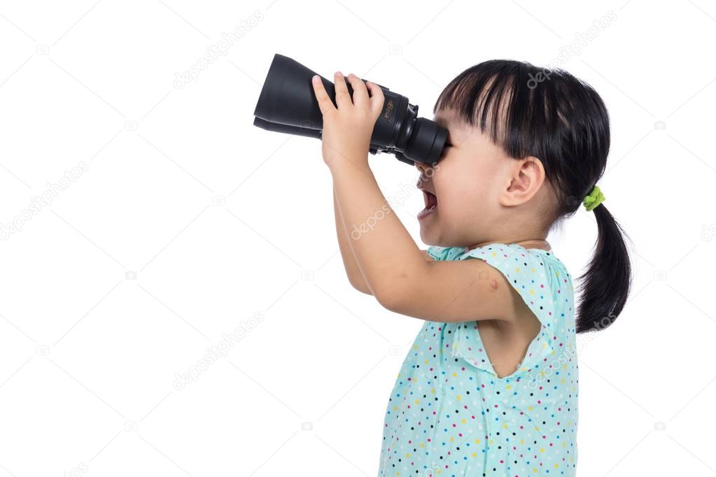 Asian Chinese little girl holding binoculars